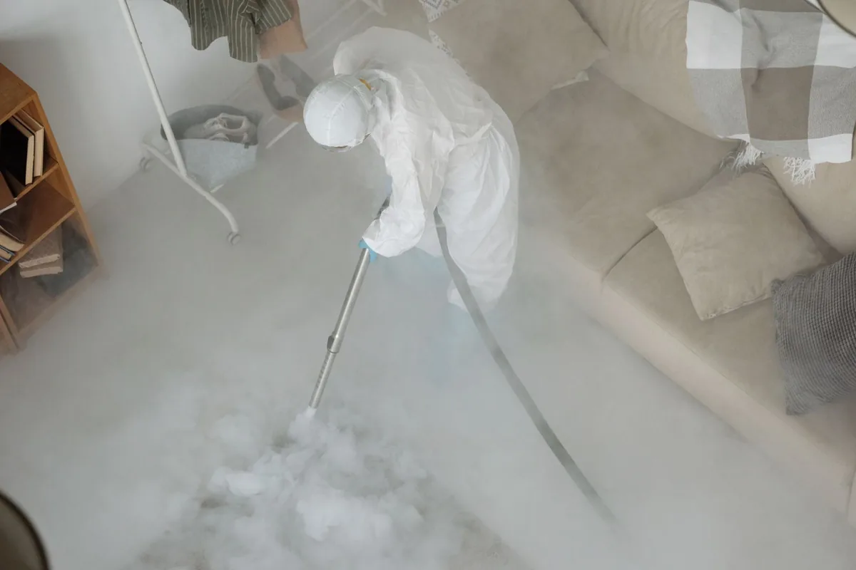 Biohazard cleanup technician in protective equipment, Moorhead, MS